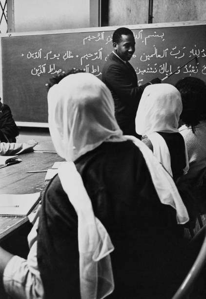 Warith Deen Mohammed teaching an Arabic class. Photographer unknown.