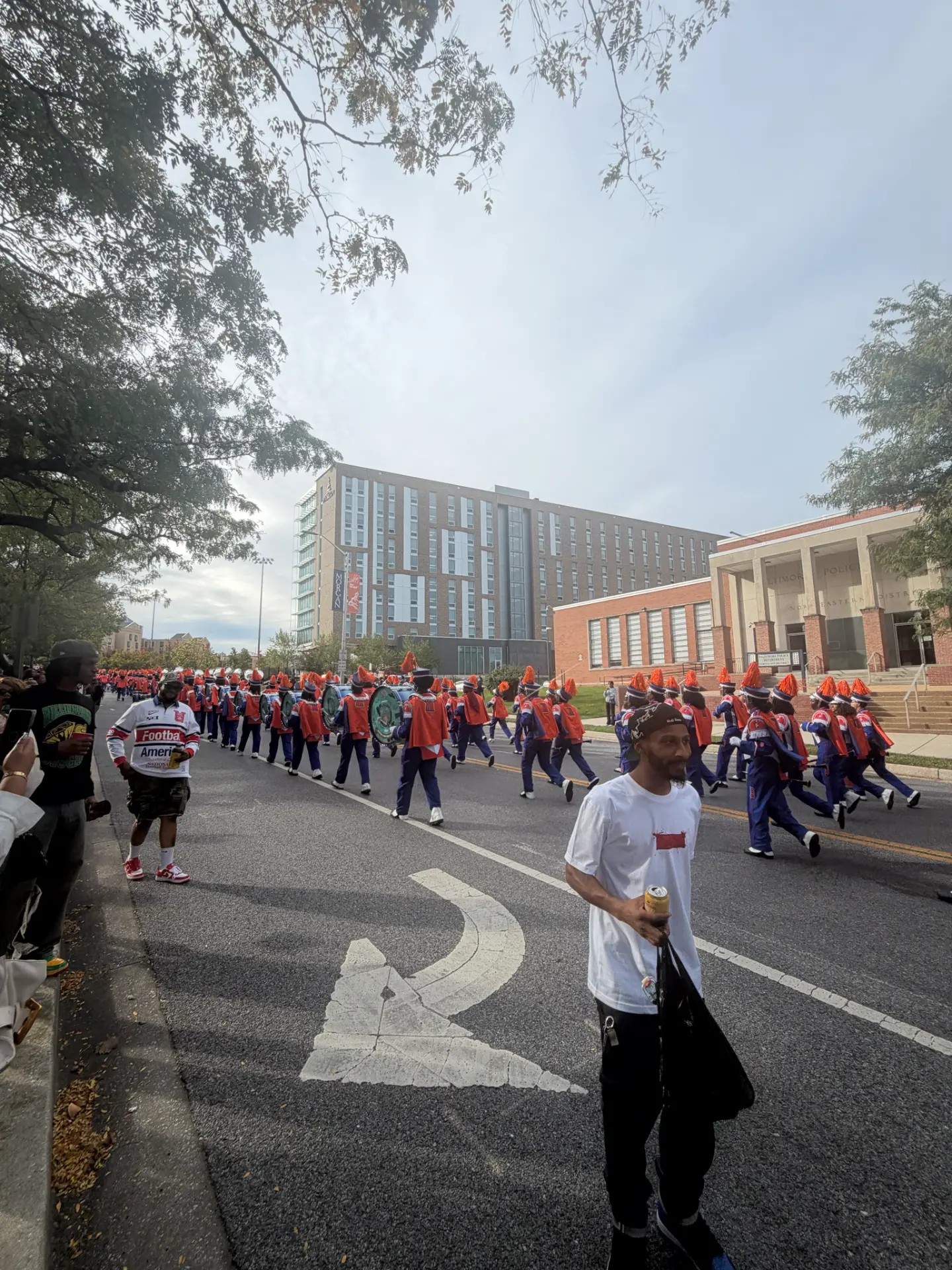 The homecoming procession approaches along the street on Saturday, October 10, 2026. Photo: Morgan Hall, MPH.