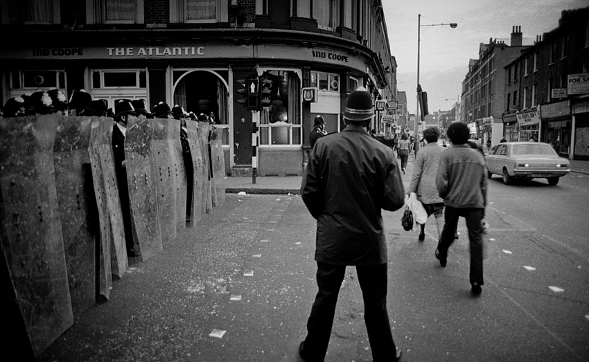 Police with riot shields outside the Atlantic Pub at Atlantic Road and Coldharbour Lane, Brixton, April 11, 1981. Photograph: Kim Aldis, via Wikimedia Commons; CC BY-SA 3.0.