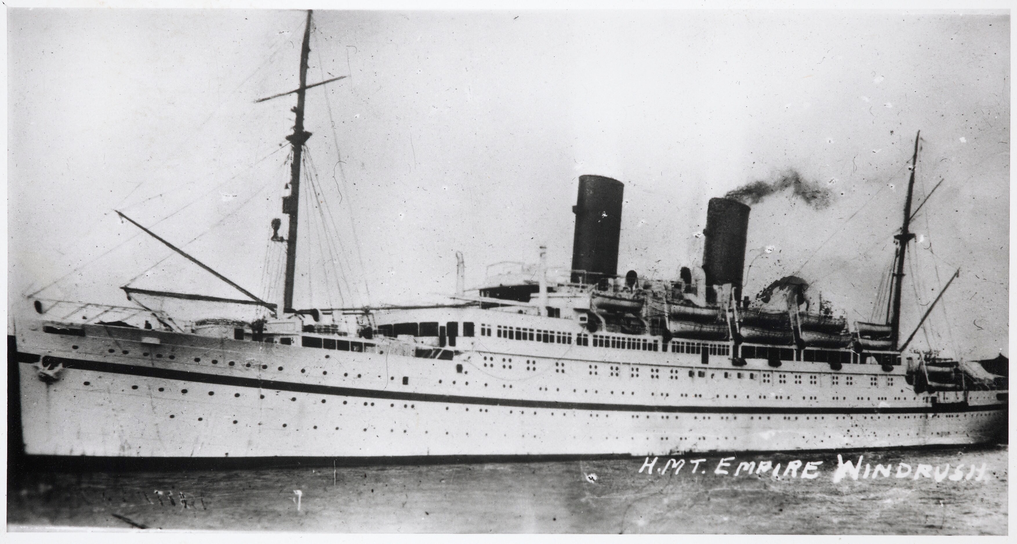 HMT Empire Windrush, photographed between 1945 and 1954; this is not a photograph of the June 1948 arrival. Royal Navy official photographer, Imperial War Museums collection FL 9448, via Wikimedia Commons. Public domain: expired Crown copyright.