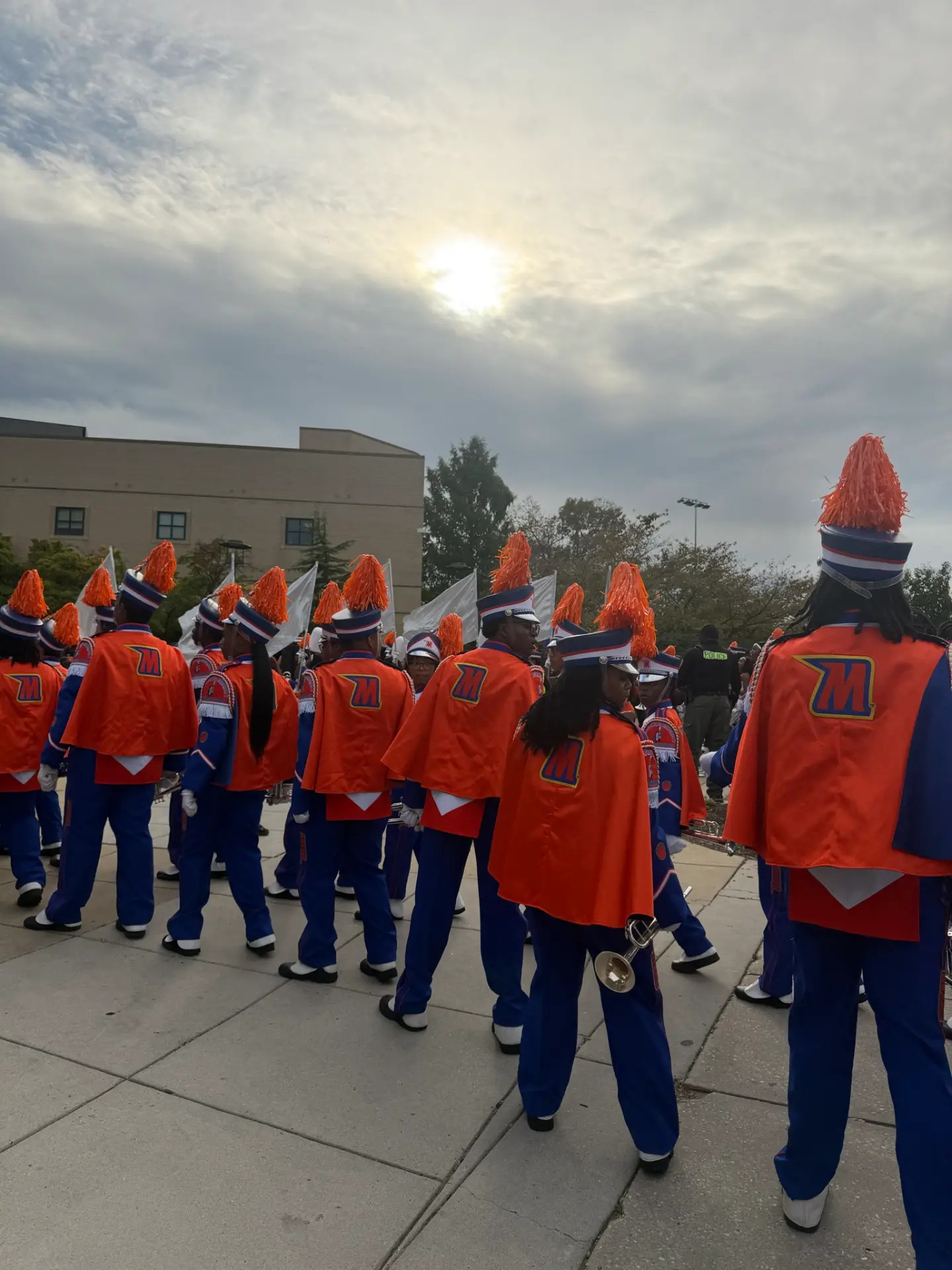 Band members gather beside the stadium during Saturday’s homecoming. Photo: Morgan Hall, MPH.