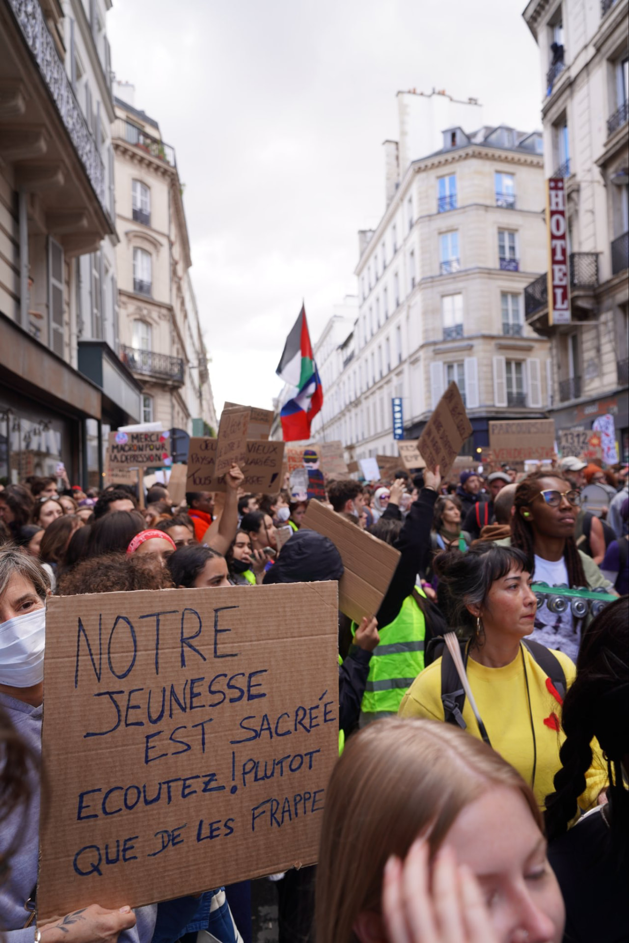 Marchers in Paris on October 17, 2026; one sign reads "Our youth is sacred! Listen to them rather than beat them." Photo: Louis Boyard via X.